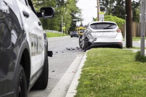 Two vehicles after a car accident on an Illinois road where a car accident lawyer helps injured victims understand their settlement timeline