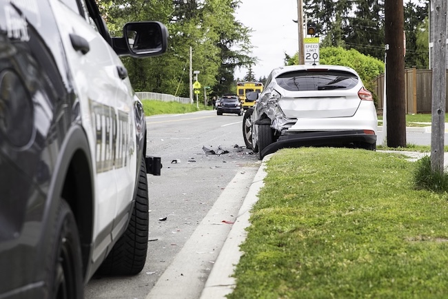 Two vehicles after a car accident on an Illinois road where a car accident lawyer helps injured victims understand their settlement timeline